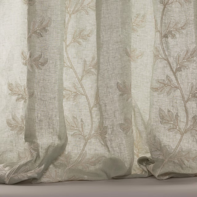 Pale old-blue sheer curtain fabric with trailing botanical leaf embroidery