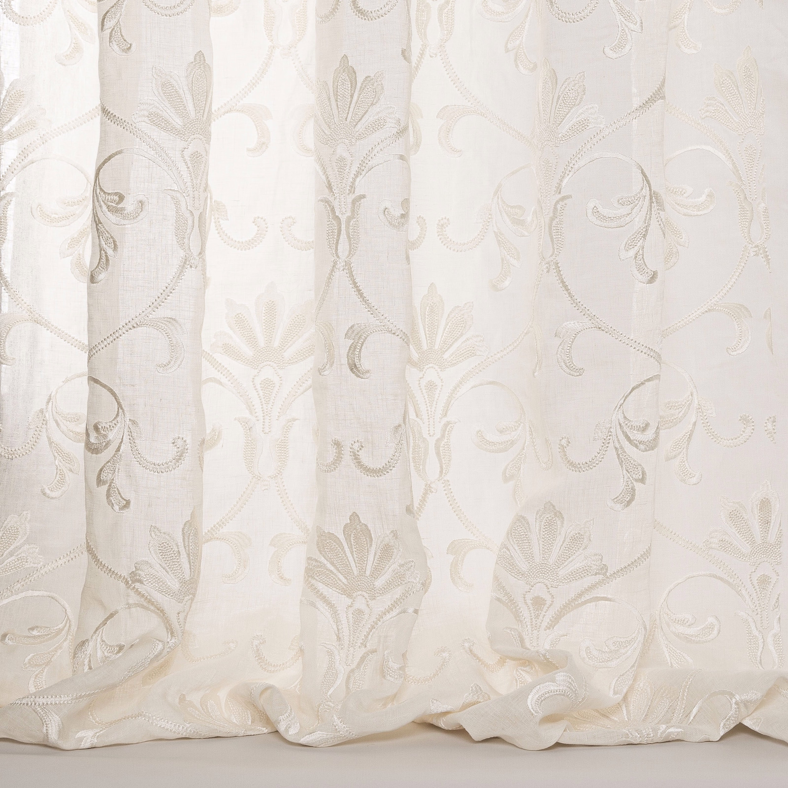 Ivory sheer curtain fabric with pale taupe scrolling damask embroidery
