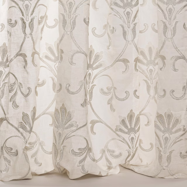 Pale silver-grey damask sheer with scrolling embroidered leaves and a linen texture
