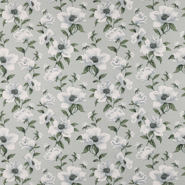 White floral print with sage green leaves on a pale aqua ground