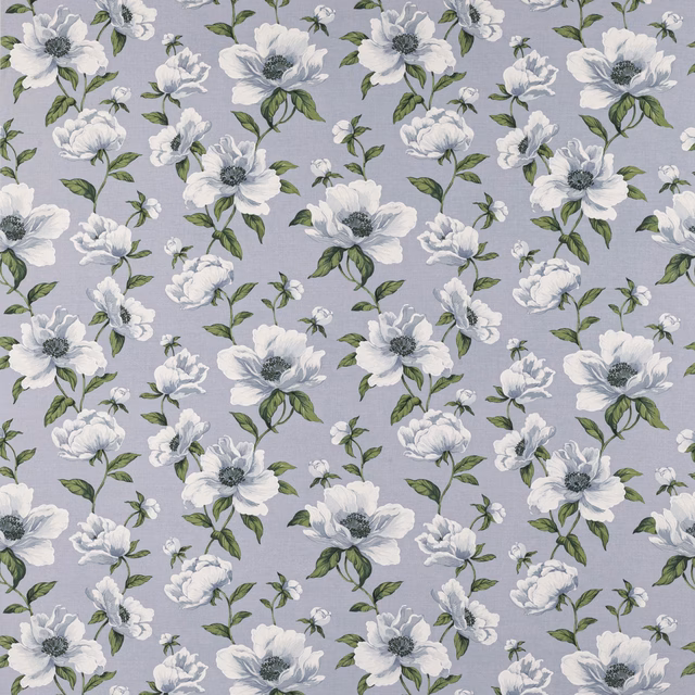 Powder-blue floral fabric with white blossoms and green leaves on a light ground