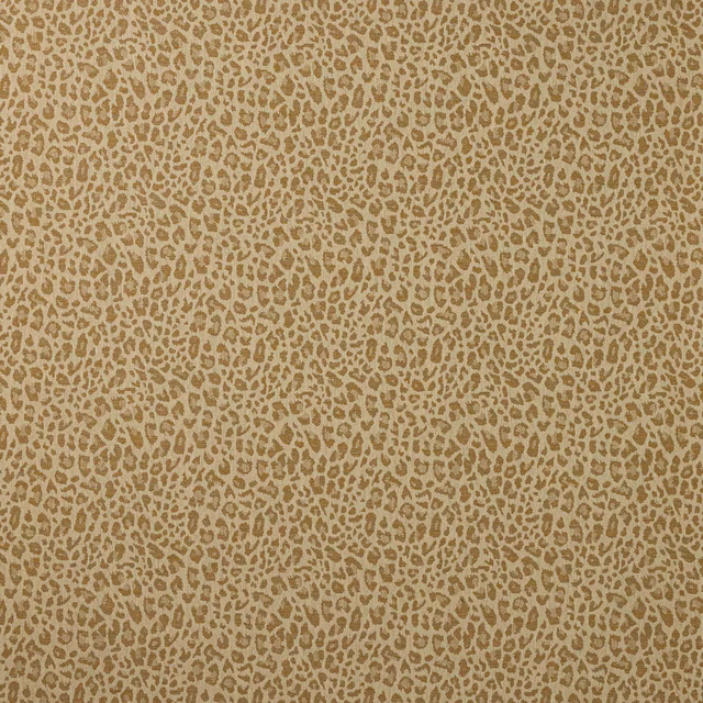 Close-up of small animal pattern in warm gold and beige woven fabric