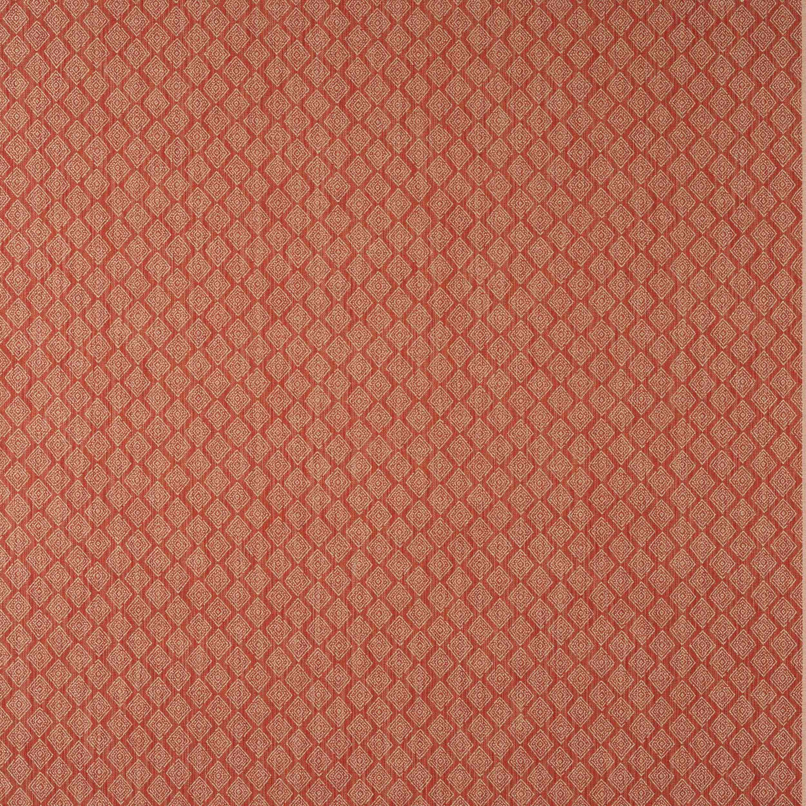 Close-up of a small diamond geometric fabric in muted terracotta red