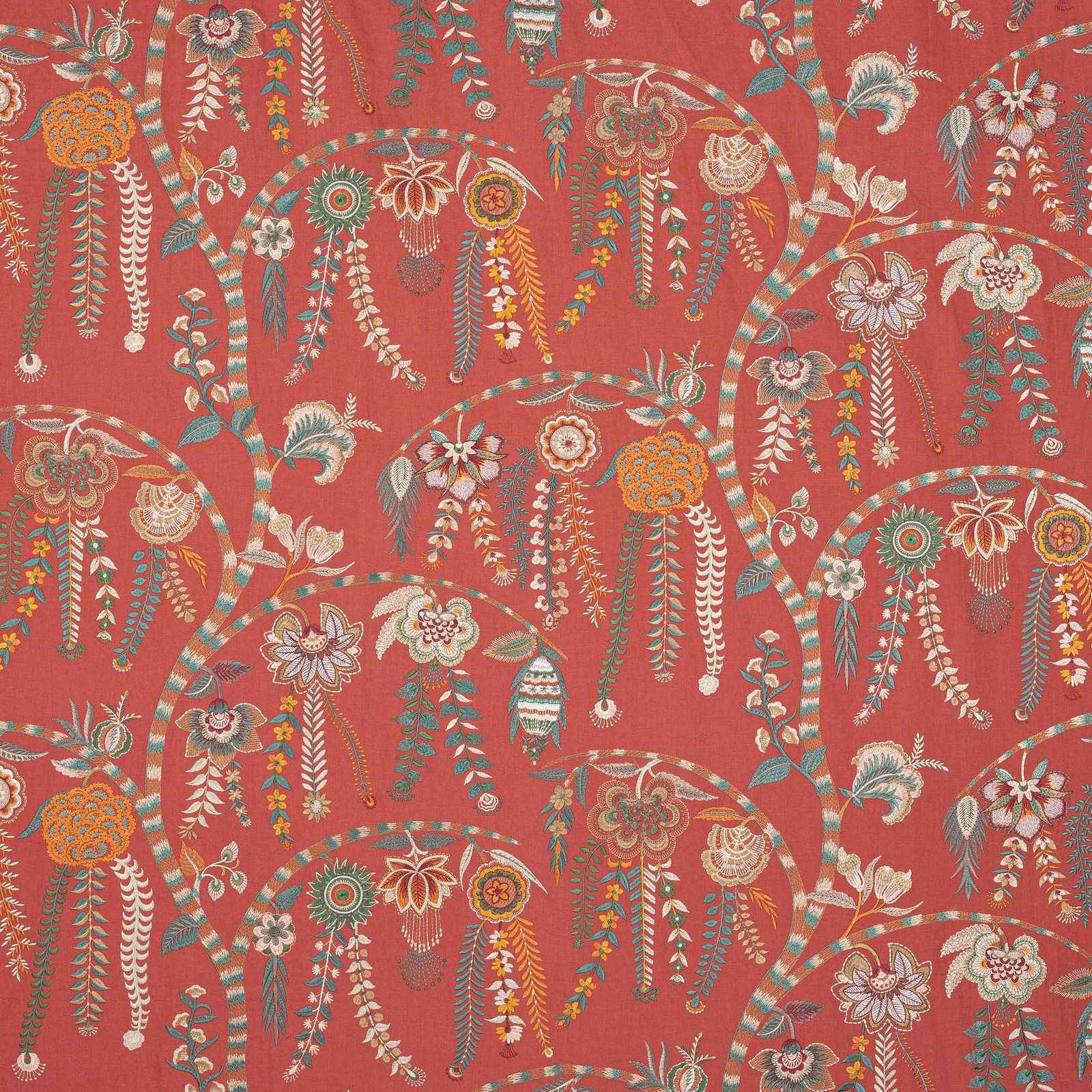 Coral red floral fabric with multicoloured embroidered tassel motifs