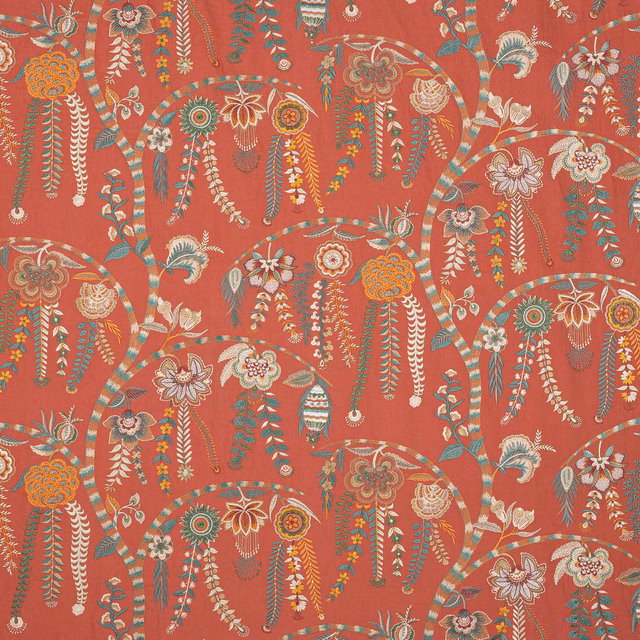 Coral red floral fabric with multicoloured embroidered tassel motifs