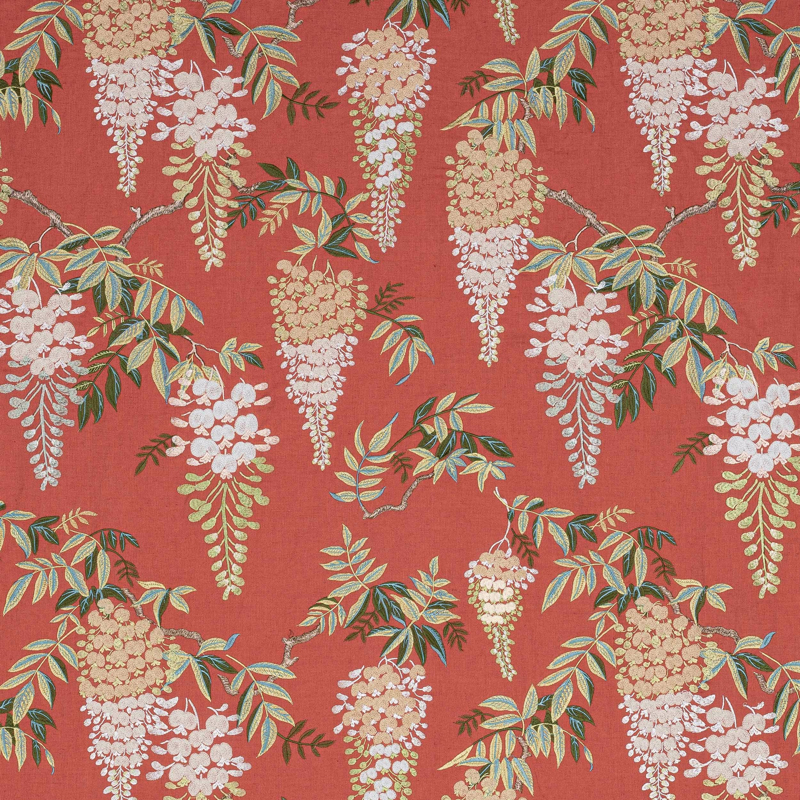 Coral-red floral fabric swatch with trailing cream blossoms and green leaves
