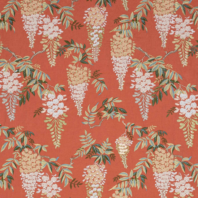 Coral-red floral fabric swatch with trailing cream blossoms and green leaves