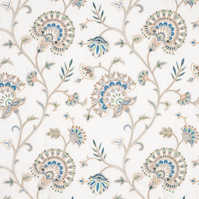 Ivory embroidered floral fabric with scrolling stems, blue and green accents