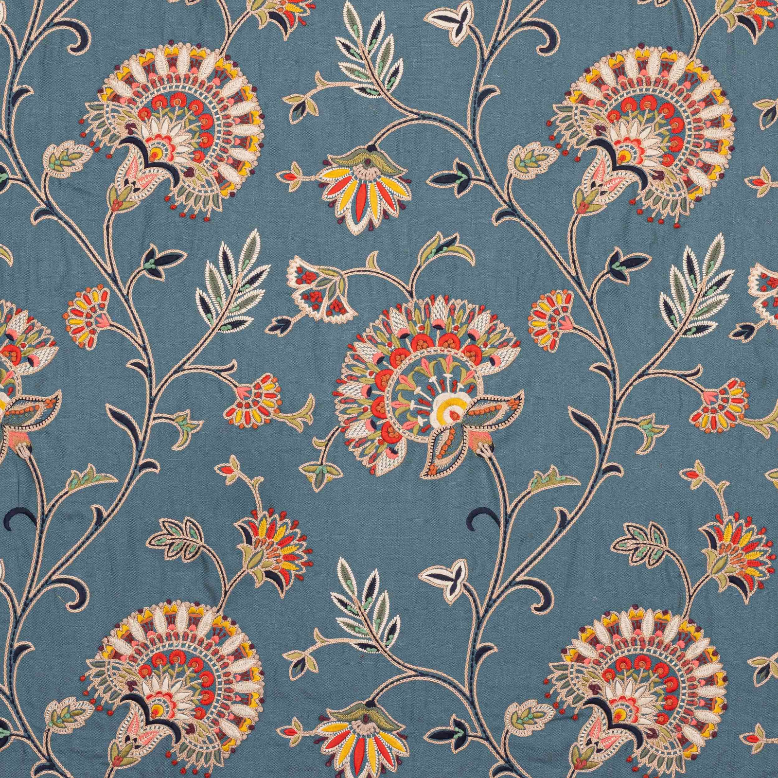 Petrol blue embroidered floral vine fabric with multicoloured blossoms and leaves