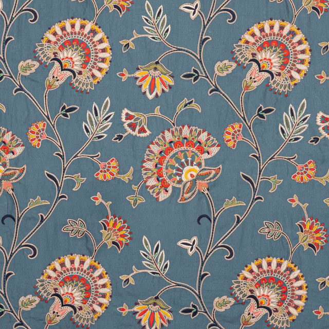 Petrol blue embroidered floral vine fabric with multicoloured blossoms and leaves