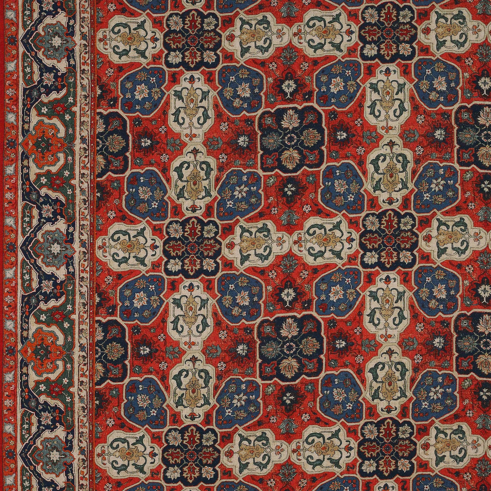 Patterned fabric swatch with antique red ground, navy, cream and green motifs