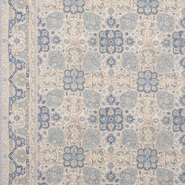 Pale blue and cream geometric woven fabric with aged floral medallions