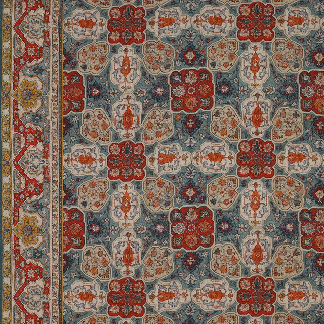Patterned fabric swatch with red medallions on an aqua ground and ivory detailing