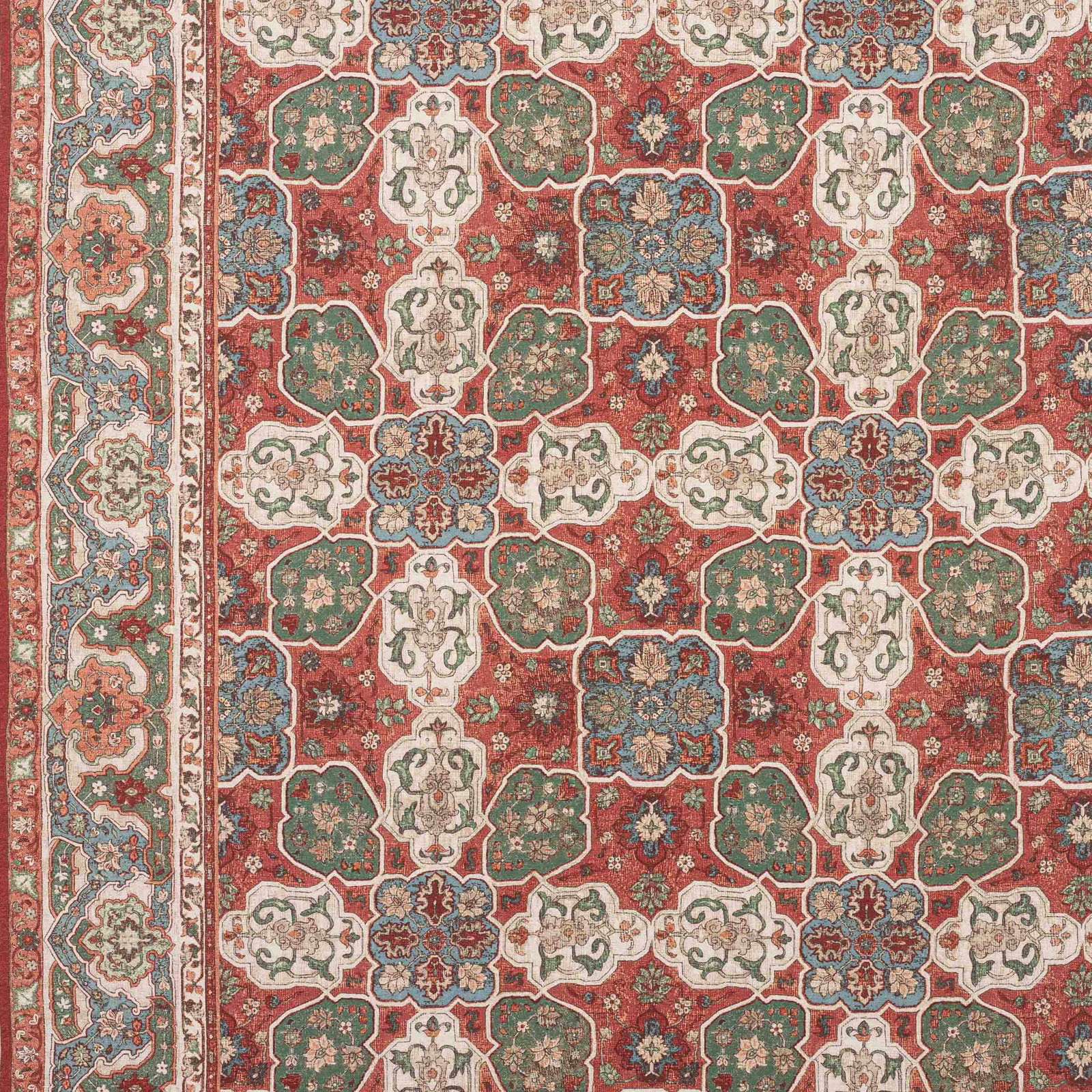 Red and green geometric patterned fabric swatch with cream and blue details