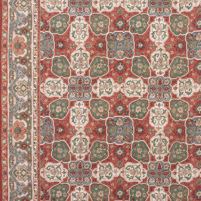 Red and green geometric patterned fabric swatch with cream and blue details