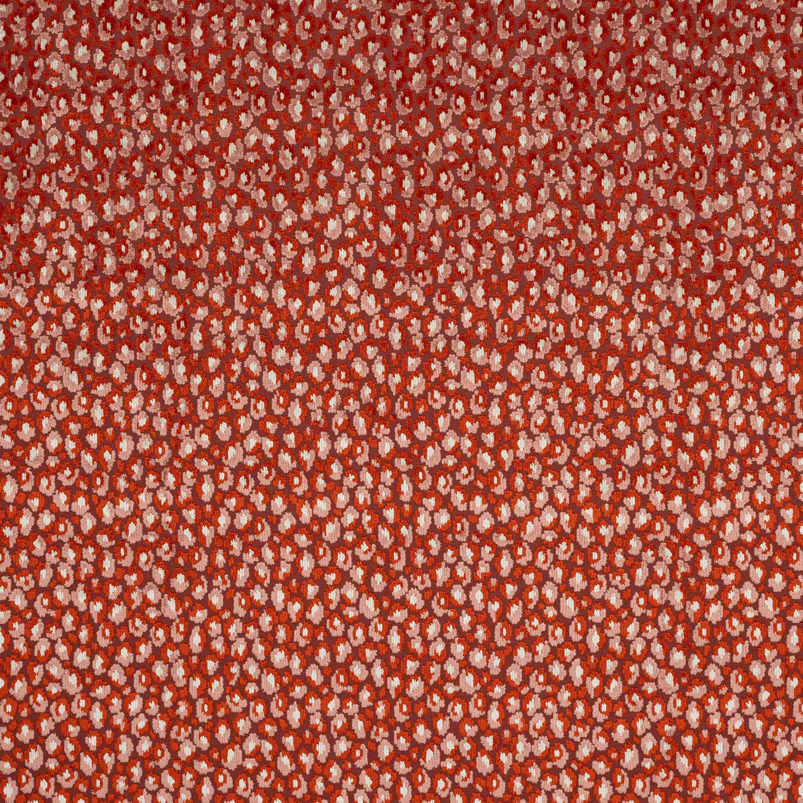 Close-up of Cleo fabric in copper red with tiny blush speckled motif
