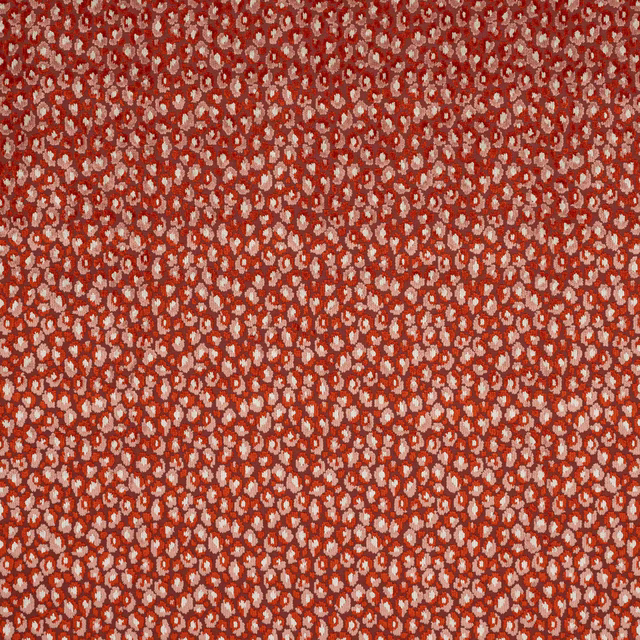 Close-up of Cleo fabric in copper red with tiny blush speckled motif