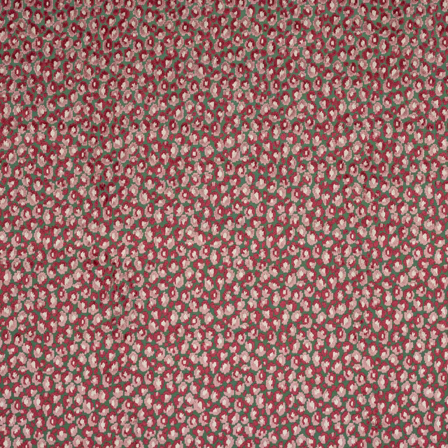 Small-scale pink and green floral woven fabric with an all-over textured repeat
