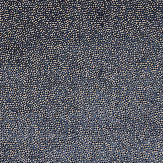 Close-up of dark midnight blue speckled woven fabric with fine textured dots