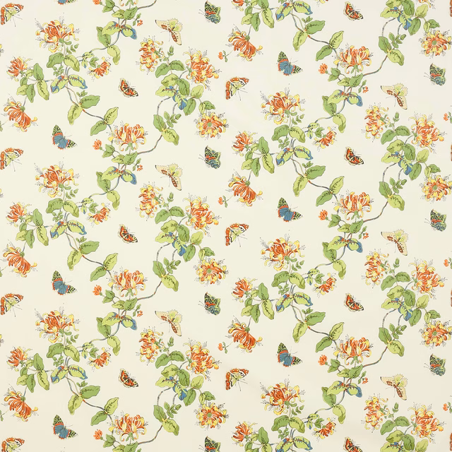 Cream cotton fabric with yellow-orange flowers, green vine leaves and butterflies