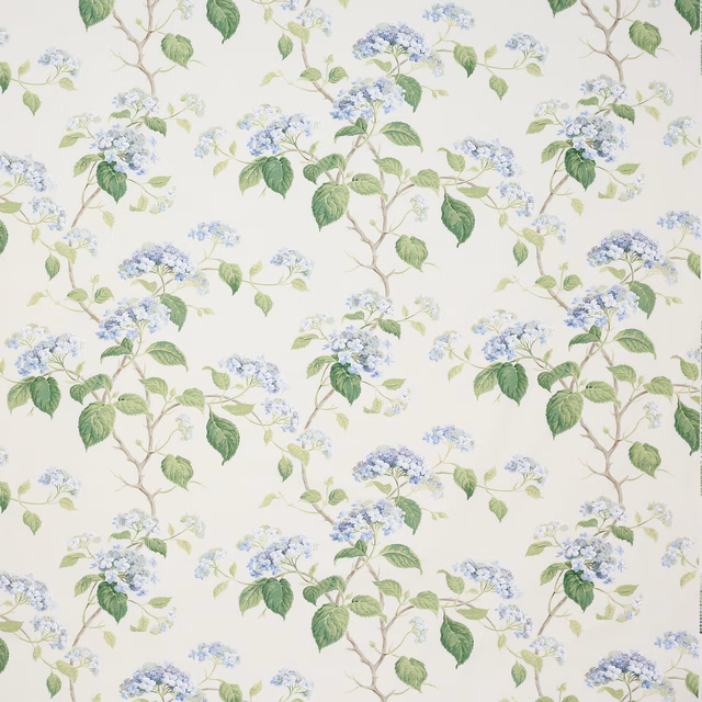 Blue and green floral cotton print with branching stems on an ivory ground