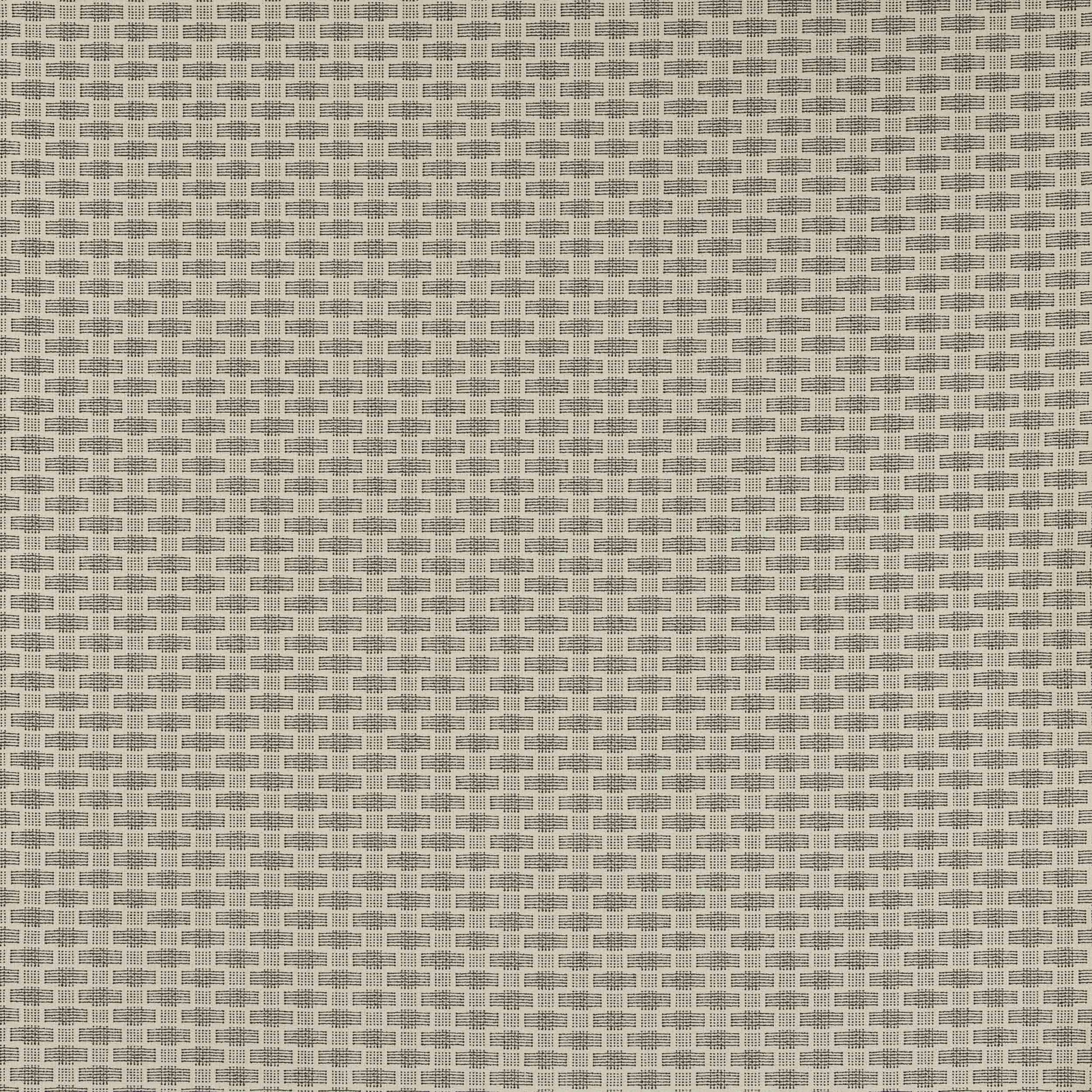 Close-up of a small geometric ivory and beige woven fabric with tiny block pattern