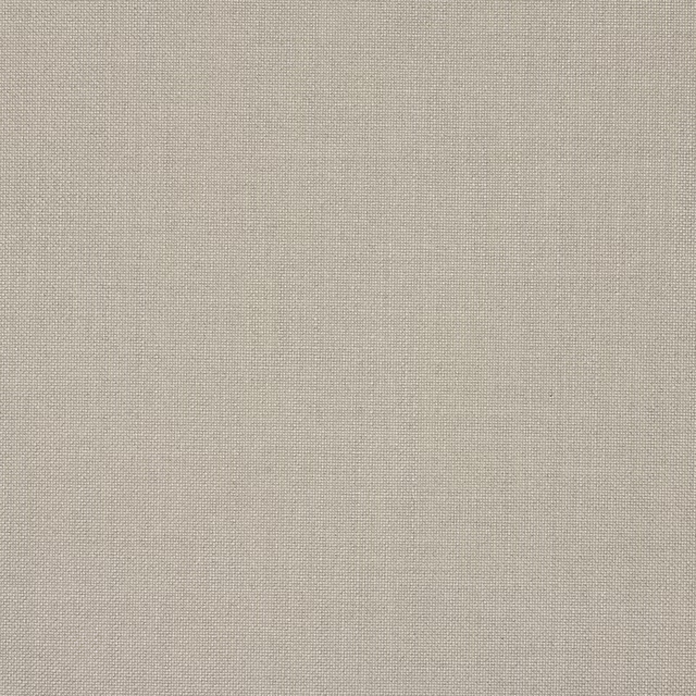 Close-up of a soft linen-beige plain woven fabric with a fine matte texture