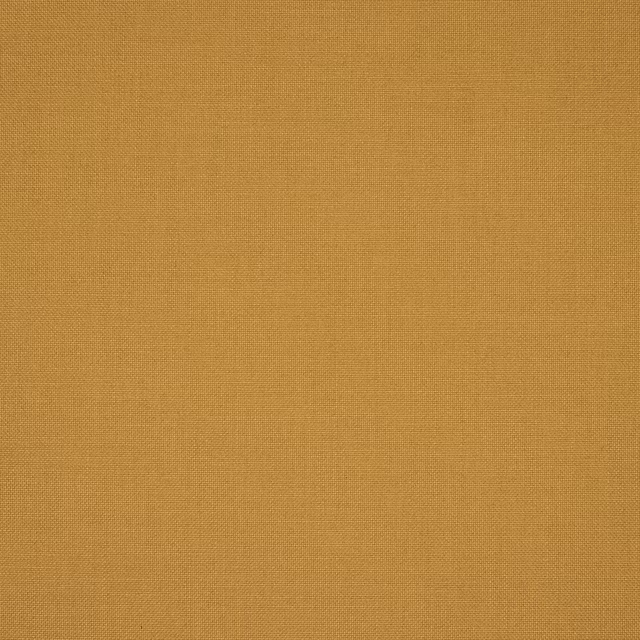 Close-up of plain woven ochre-gold fabric with a fine, even texture