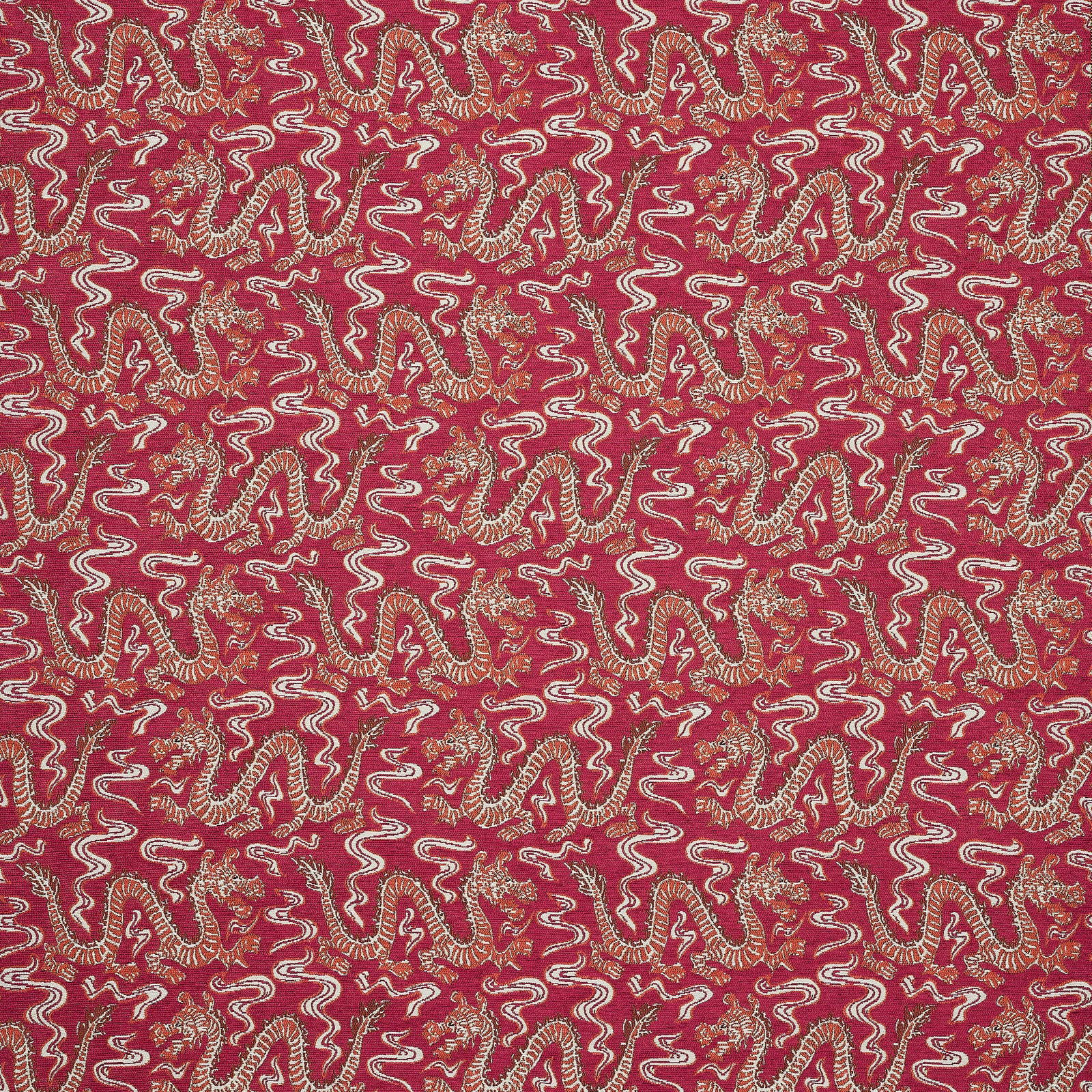 Patterned fabric swatch in deep raspberry red with cream and gold scrolling motif