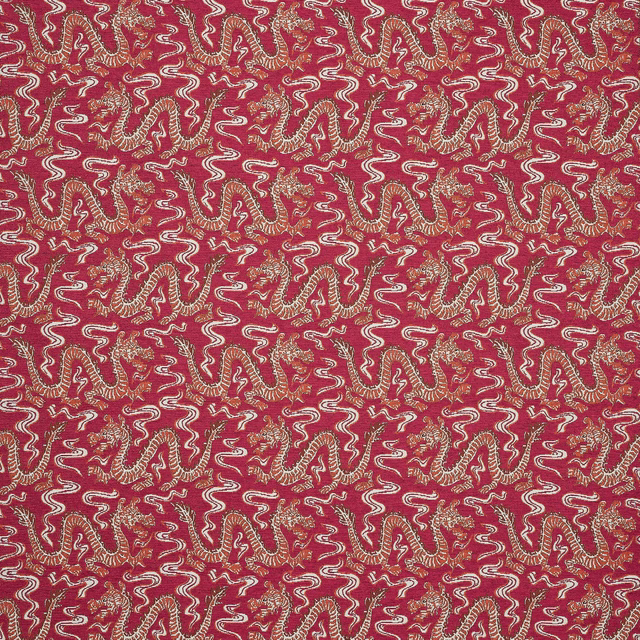 Patterned fabric swatch in deep raspberry red with cream and gold scrolling motif