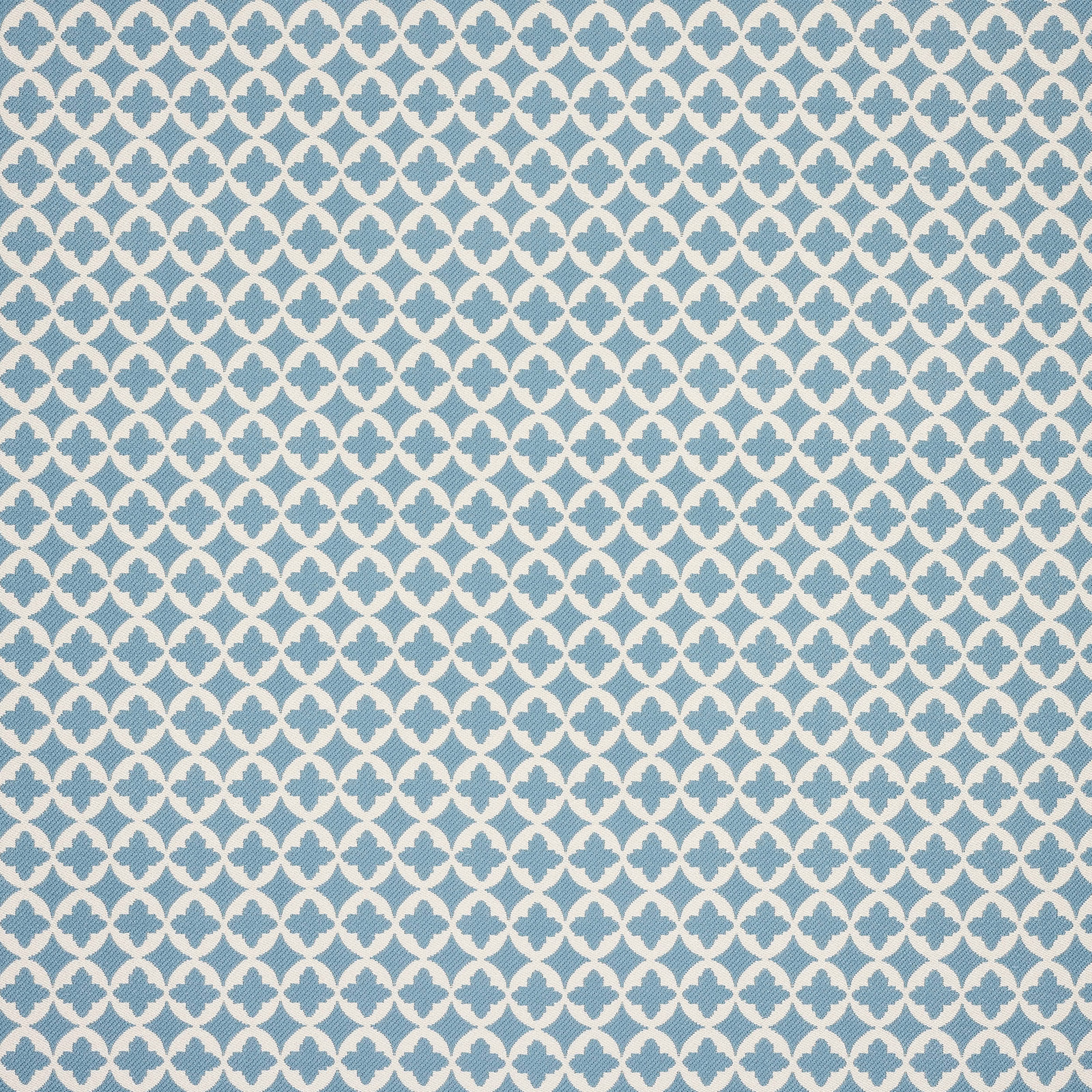 Blue clover trellis fabric on a pale ground, shown as a close swatch