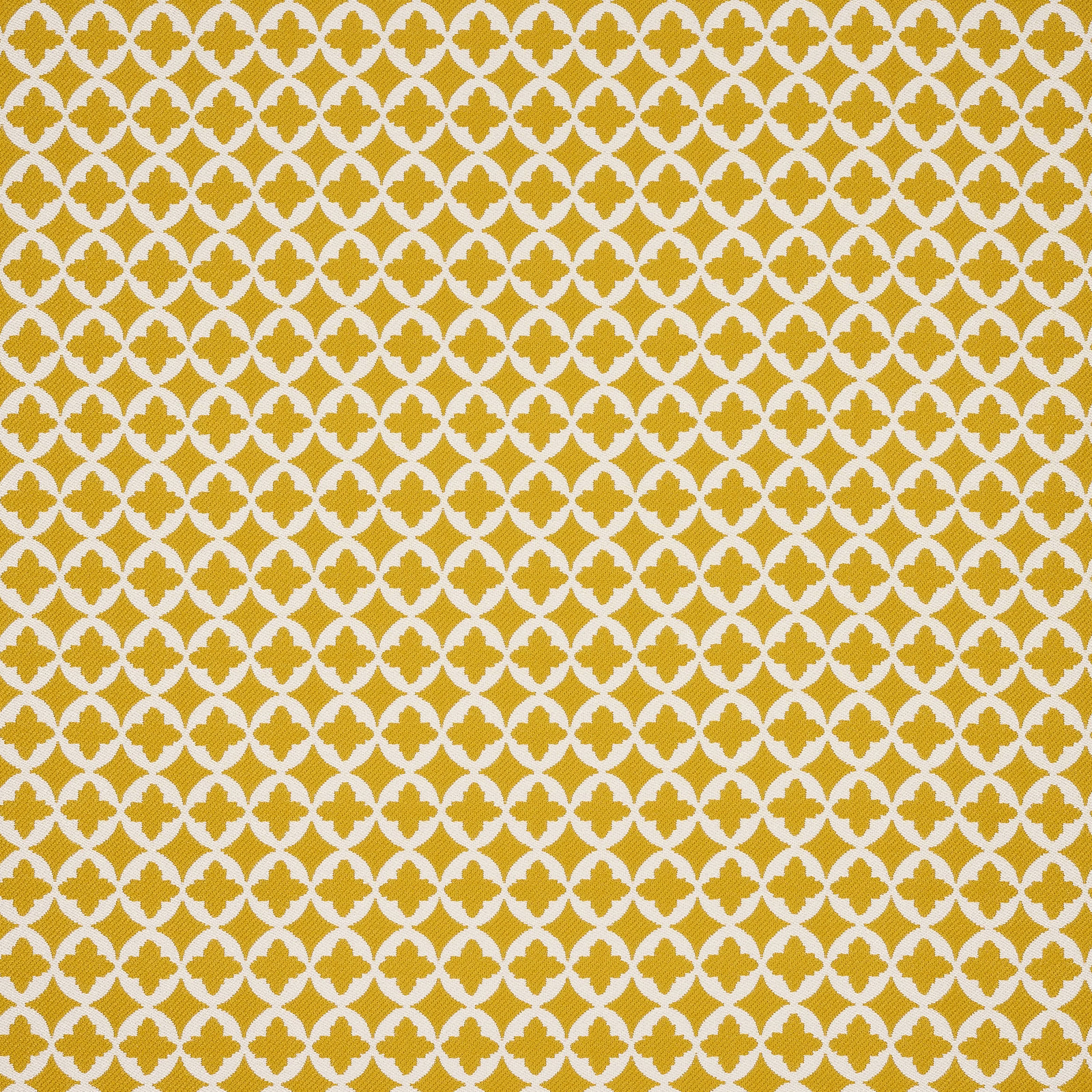 Mustard-gold geometric fabric with a small repeating quatrefoil motif on an off-white ground