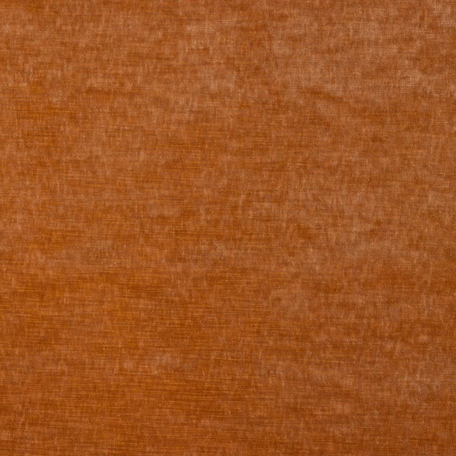Burnt coral orange velvet with a softly mottled, light-catching pile