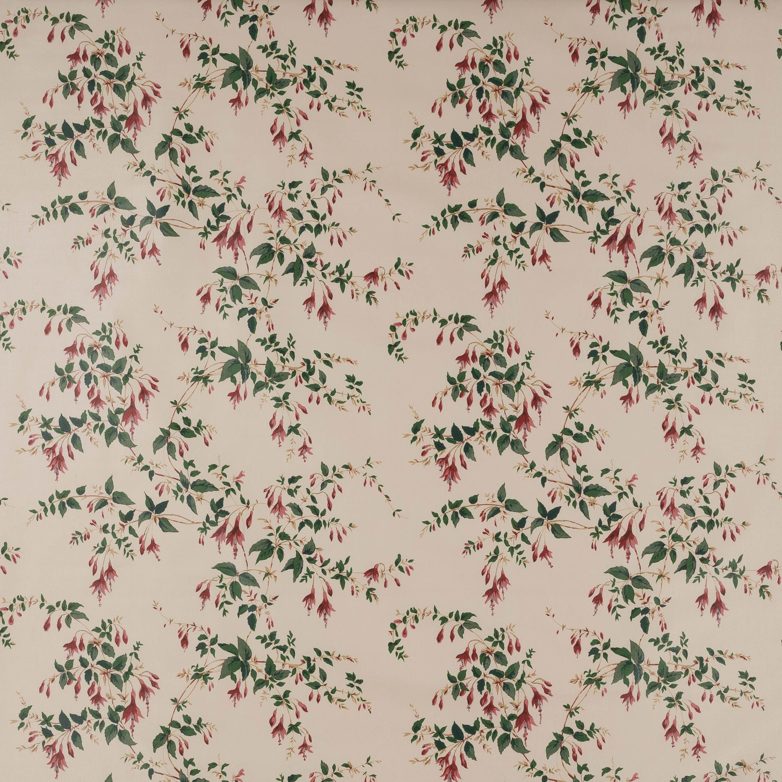 Cream cotton fabric with scattered green leafy floral sprays and fuchsia red blossoms