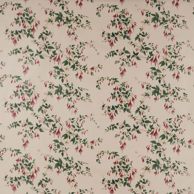 Cream cotton fabric with scattered green leafy floral sprays and fuchsia red blossoms