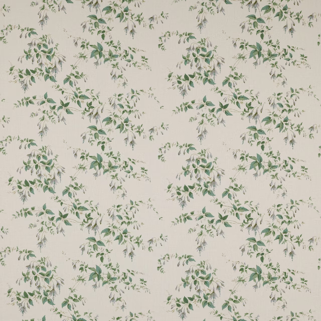 Ivory linen fabric with scattered green leafy sprigs and soft grey accents