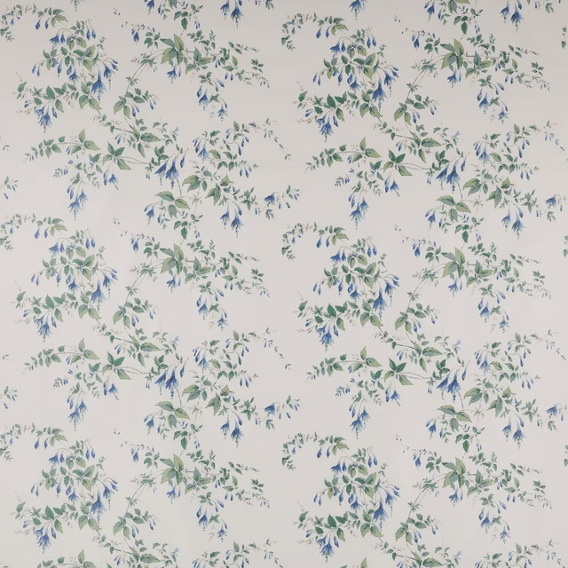 Pale ground cotton fabric with scattered blue and green floral sprigs