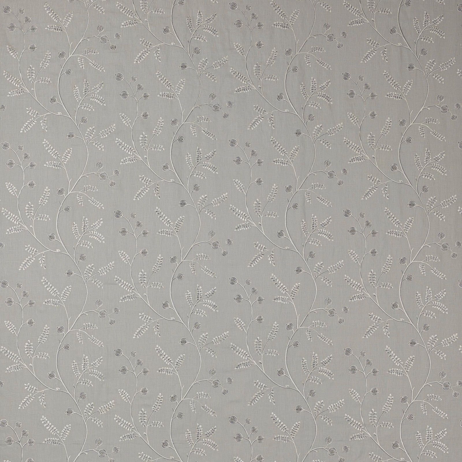 Soft blue-grey fabric with trailing embroidered floral vines and small sprigs