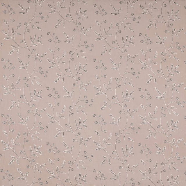 Soft blush pink botanical fabric with delicate trailing leaf sprigs