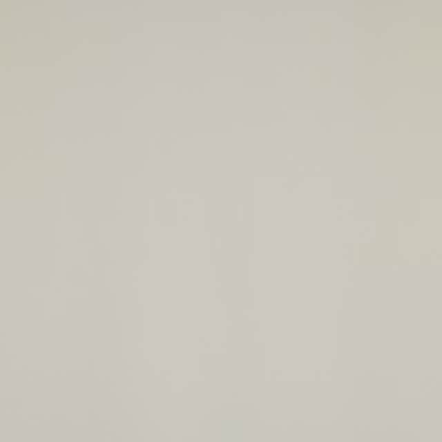Close-up of a soft ivory plain wool fabric swatch