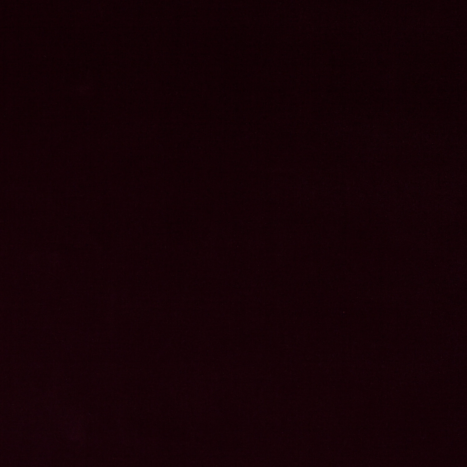 Close-up of deep dark amethyst cotton velvet with a smooth plush pile