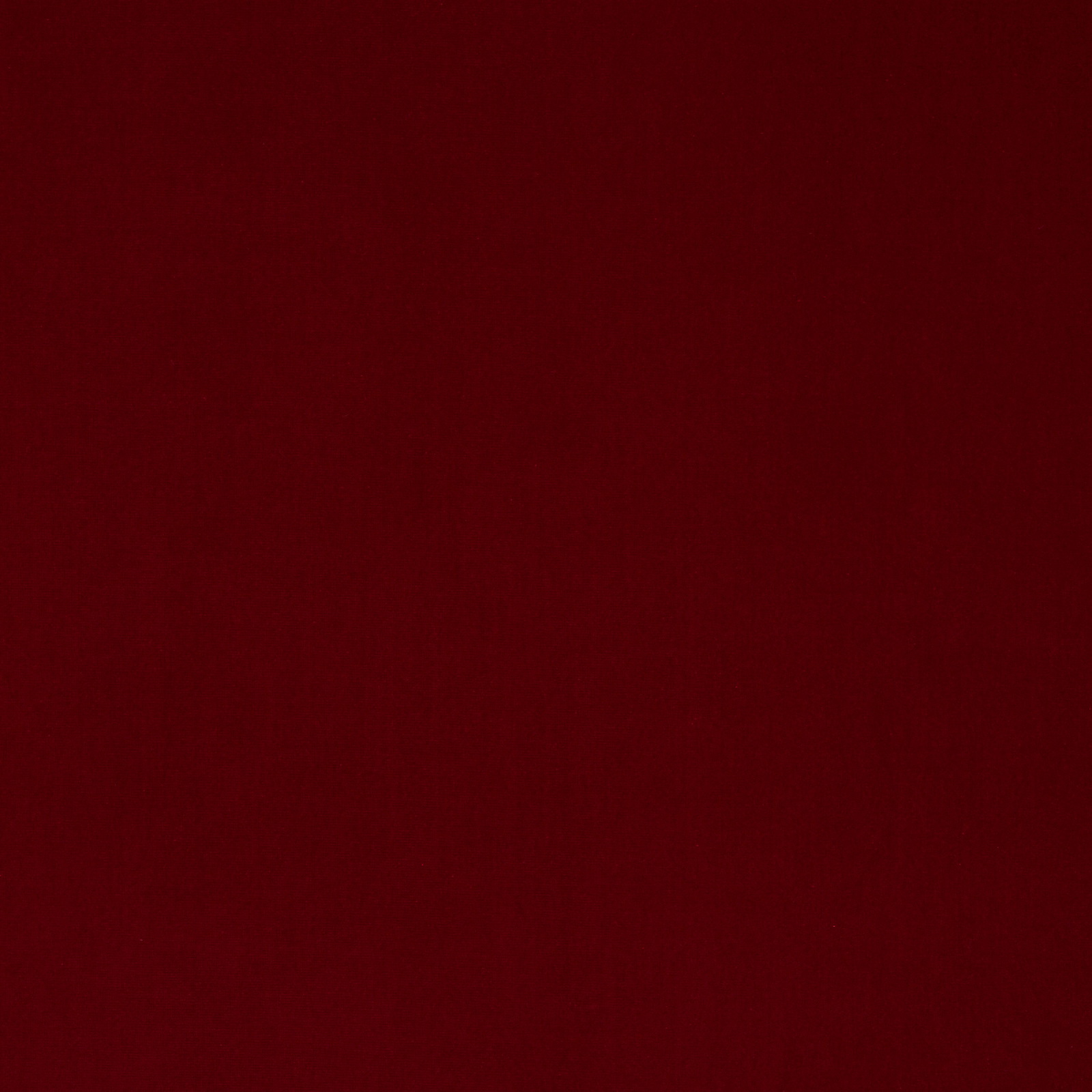 Deep oxblood red cotton velvet swatch with a subtle pile sheen
