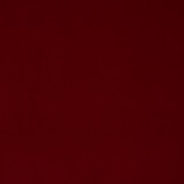 Deep oxblood red cotton velvet swatch with a subtle pile sheen