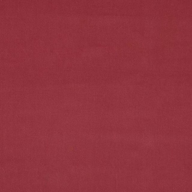 Close-up of a dusty rose pink plain velvet swatch with soft pile