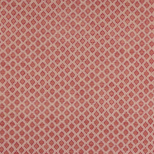 Small geometric fabric swatch in muted red, blush and cream