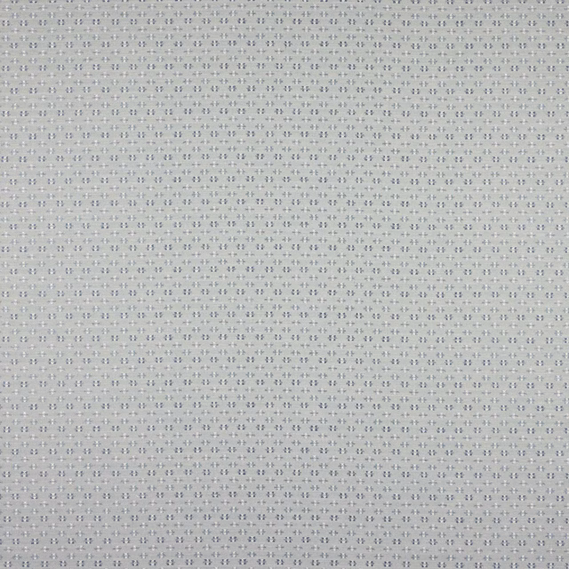 Soft washed blue fabric with tiny dotted woven pattern and subtle linen texture