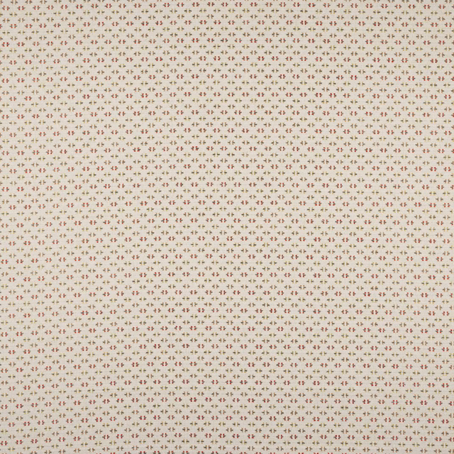 Creamy sand fabric with tiny repeating red and taupe motif
