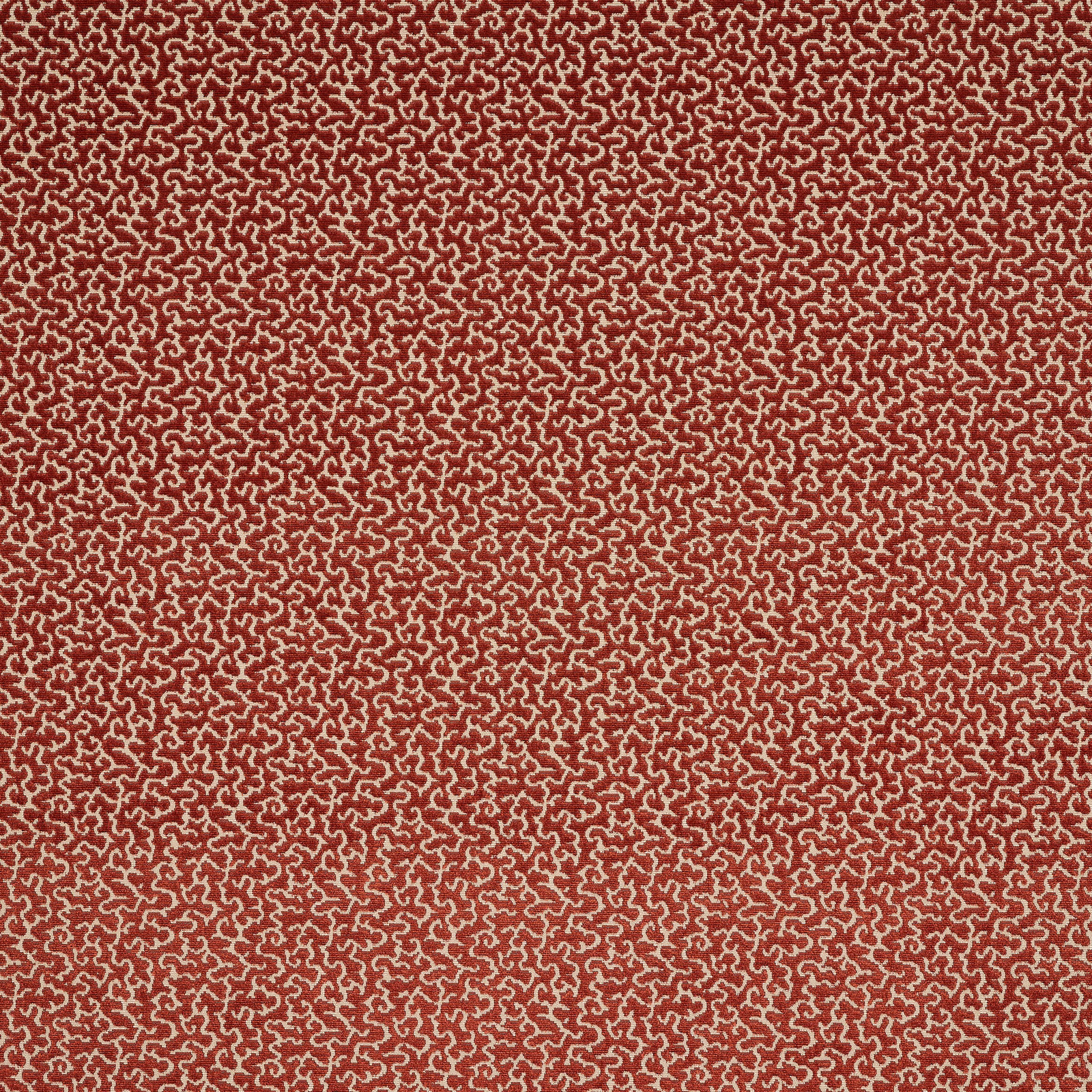 Small-scale brick red and oat scroll pattern woven tightly across the swatch