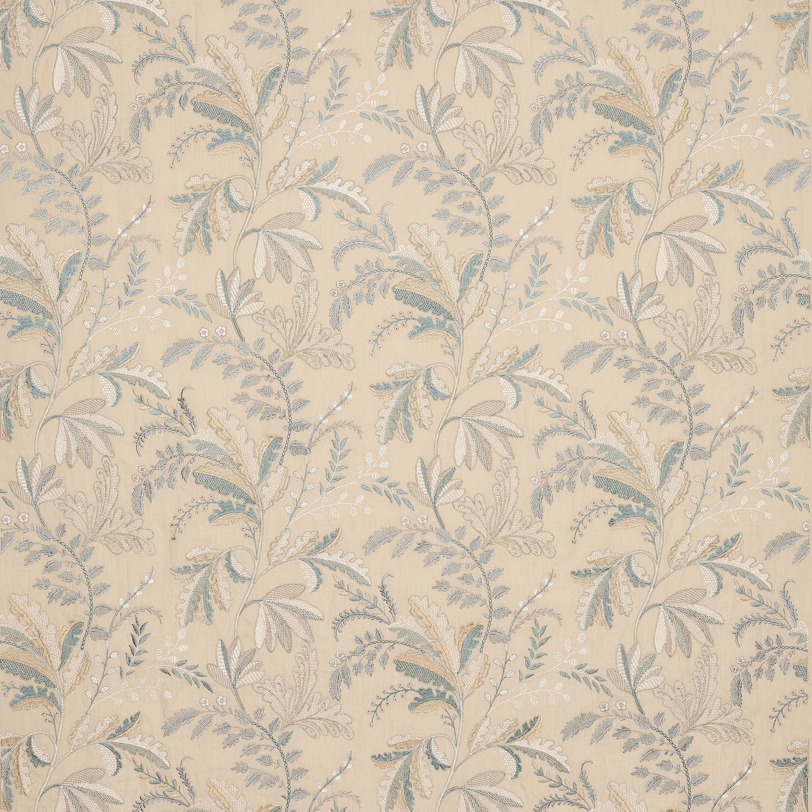 Pale blue and ivory trailing floral fabric on a warm cream ground