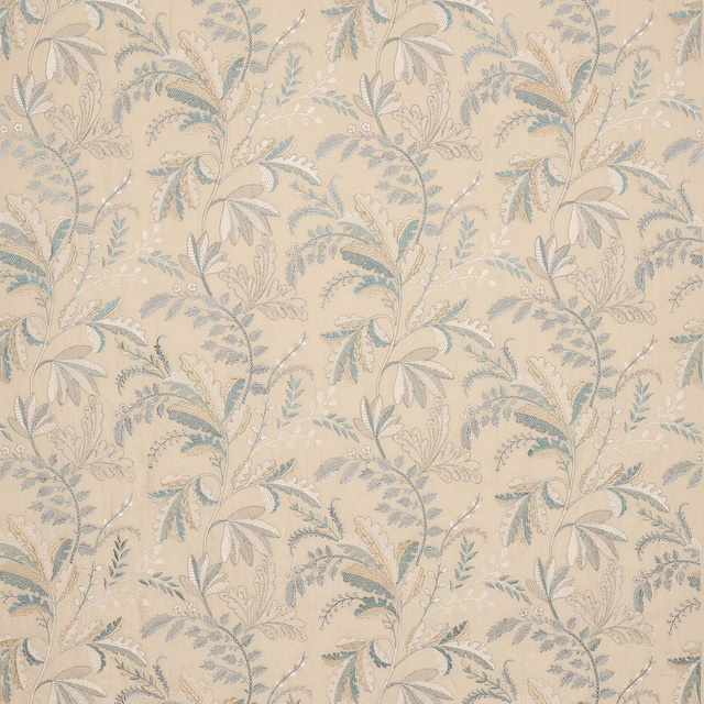 Pale blue and ivory trailing floral fabric on a warm cream ground